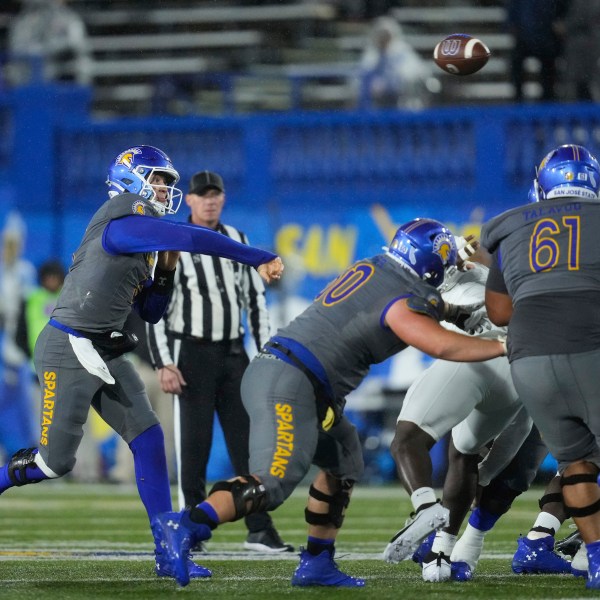 San Jose State quarterback Walker Eget, left, passes during the first half of an NCAA college football game against UNLV, Friday, Nov. 22, 2024, in San Jose, Calif. (AP Photo/Godofredo A. Vásquez)