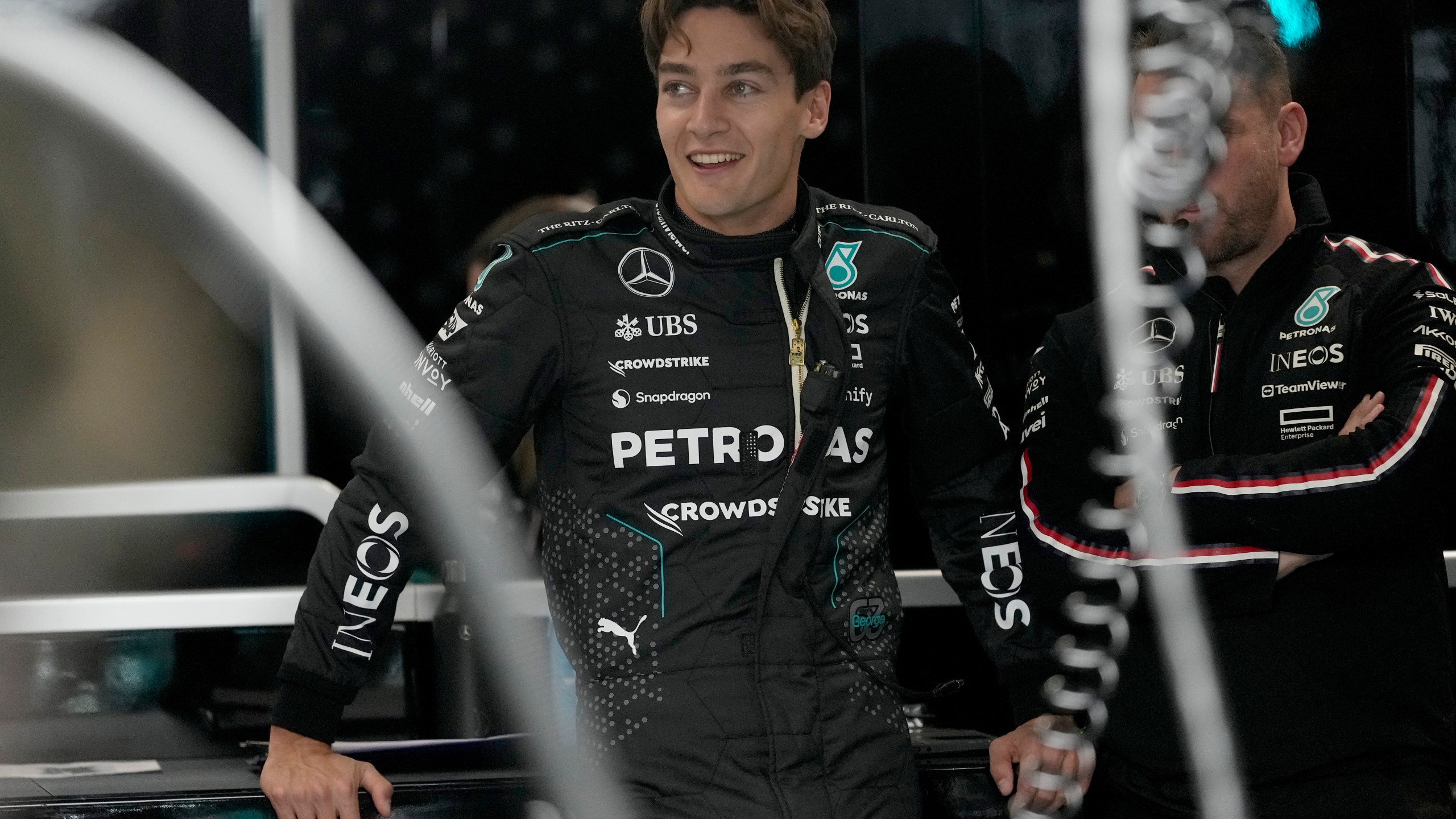 Mercedes driver George Russell, of Britain, waits in the garage area prior to a practice session for the Formula One U.S. Grand Prix auto race, Thursday, Nov. 21, 2024, in Las Vegas. (AP Photo/Matt York)