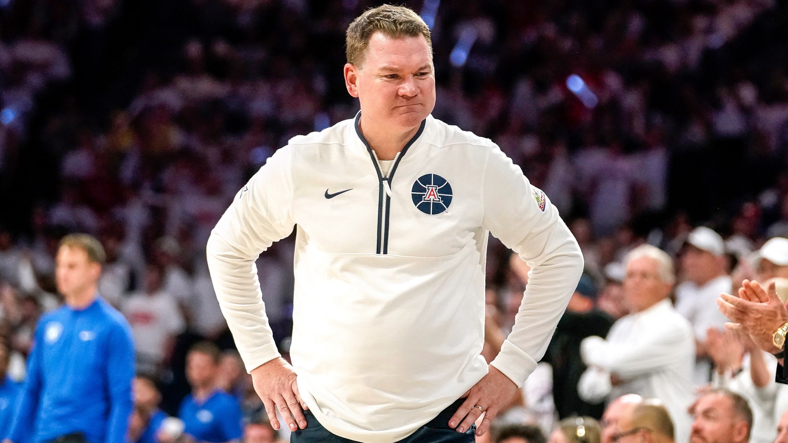 Arizona Wildcats coach Tommy Lloyd reacts to a call against his team during the second half of an NCAA college basketball game against Duke Friday, Nov. 22, 2024, in Tucson, Ariz. (AP Photo/Darryl Webb)