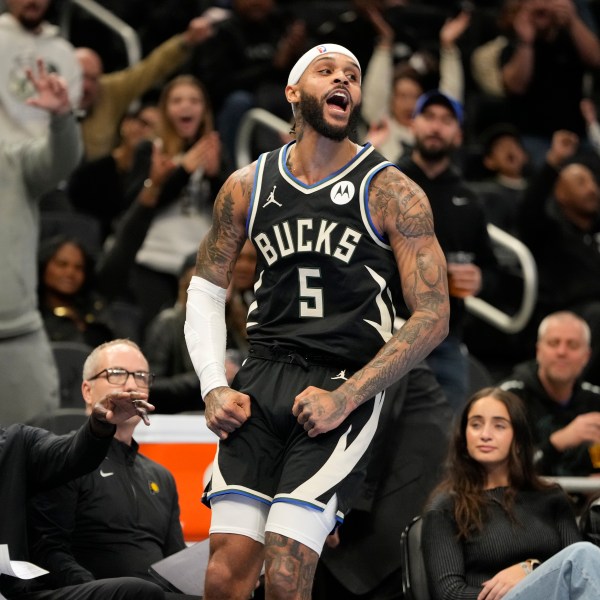 Milwaukee Bucks' Gary Trent Jr. reacts after making a threepointer in the final seconds of the first half of an Emirates NBA cup tournament basketball game against the Indiana Pacers Friday, Nov. 22, 2024, in Milwaukee. (AP Photo/Morry Gash)