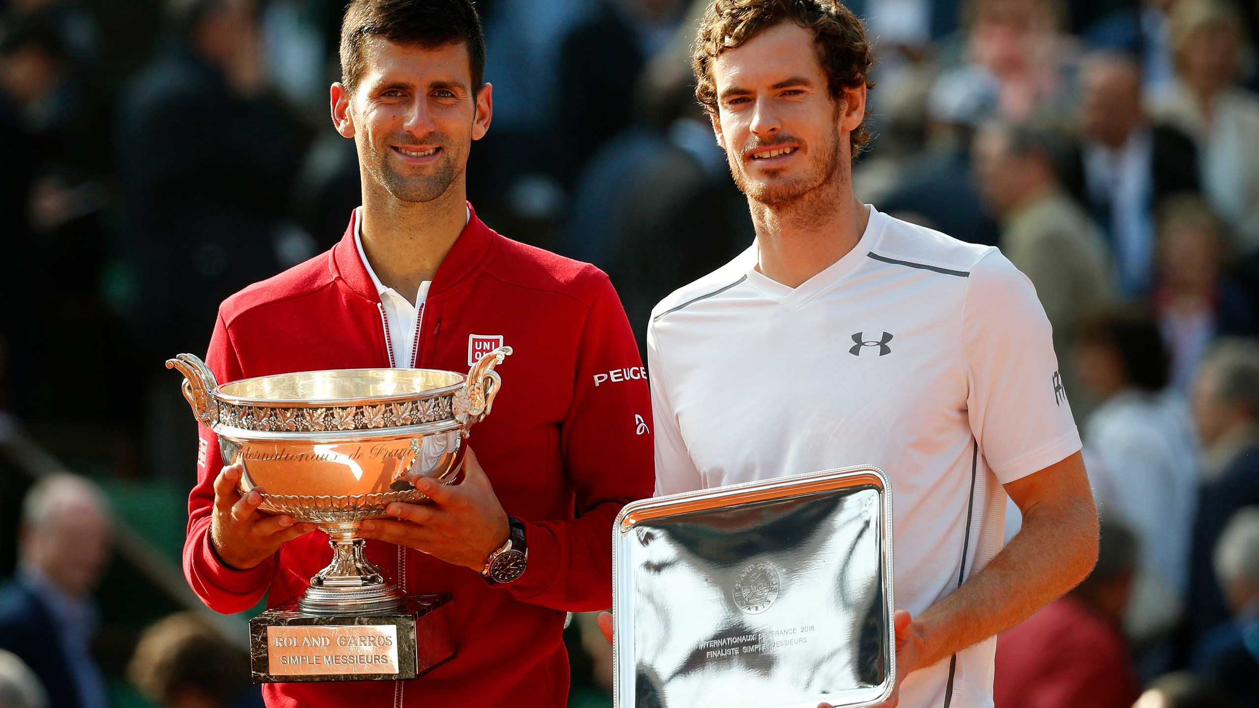 FILE - Serbia's Novak Djokovic, left, and Britain's Andy Murray holds their trophy after their final match of the French Open tennis tournament at the Roland Garros stadium, Sunday, June 5, 2016 in Paris. (AP Photo/Alastair Grant, File)