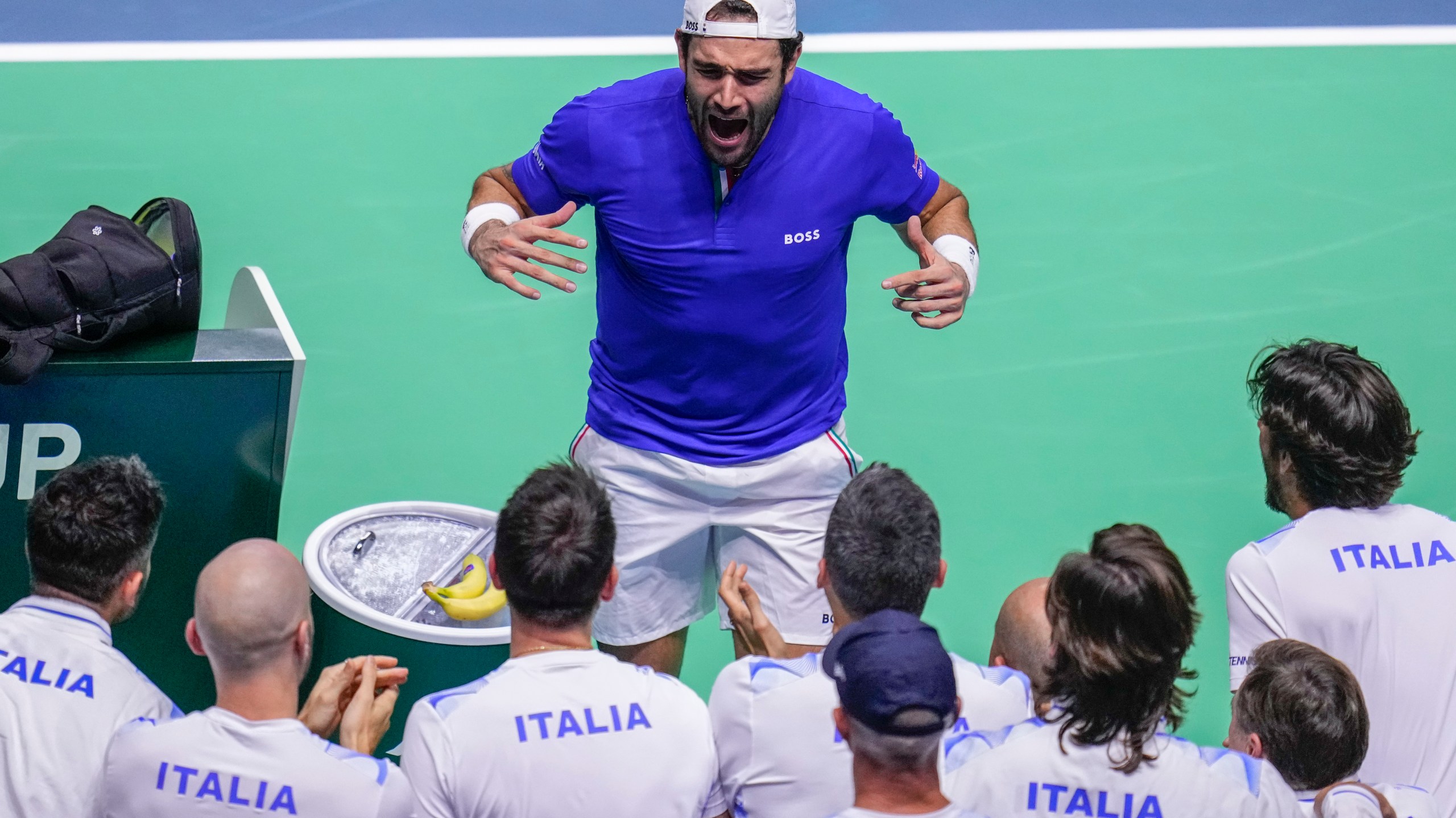 Italy's Matteo Berrettini celebrates after beating Australia's Thanasi Kokkinakis during the Davis Cup semifinal at the Martin Carpena Sports Hall in Malaga, southern Spain, on Saturday, Nov. 23, 2024. (AP Photo/Manu Fernandez)