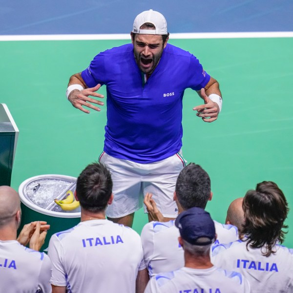 Italy's Matteo Berrettini celebrates after beating Australia's Thanasi Kokkinakis during the Davis Cup semifinal at the Martin Carpena Sports Hall in Malaga, southern Spain, on Saturday, Nov. 23, 2024. (AP Photo/Manu Fernandez)