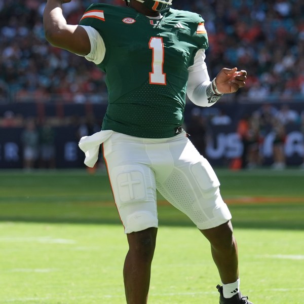 Miami quarterback Cam Ward (1) looks to pass during the first half of an NCAA college football game against Wake Forest, Saturday, Nov. 23, 2024, in Miami Gardens, Fla. (AP Photo/Lynne Sladky)