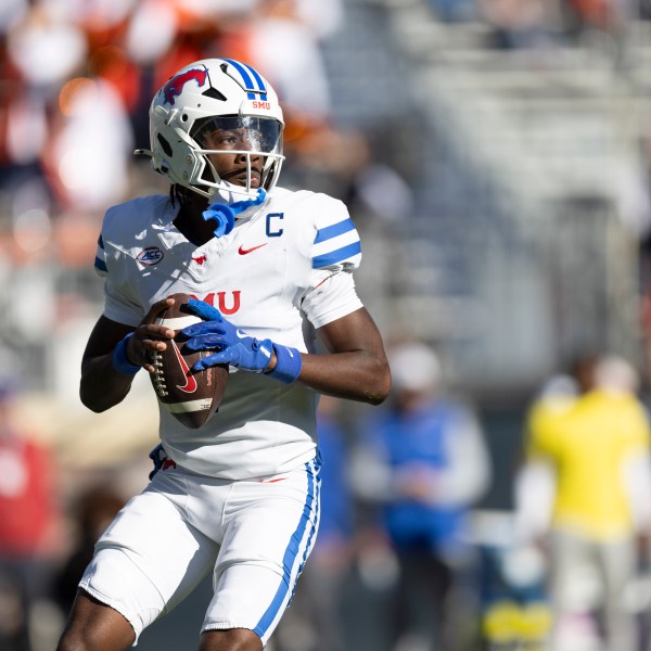 SMU quarterback Kevin Jennings (7) looks to pass during the first half of an NCAA college football game against Virginia, Saturday, Nov. 23, 2024, in Charlottesville, Va. (AP Photo/Mike Kropf)