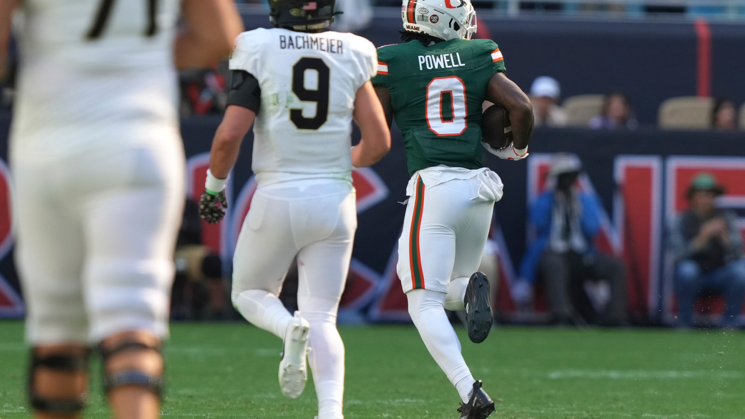 Miami defensive back Mishael Powell (0) runs back an interception to score a touchdown during the first half of an NCAA college football game against against Wake Forest, Saturday, Nov. 23, 2024, in Miami Gardens, Fla. (AP Photo/Lynne Sladky)