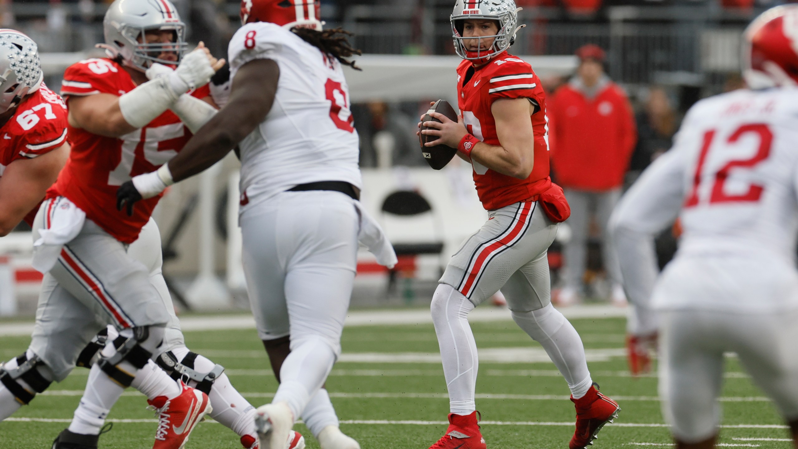 Ohio State quarterback Will Howard drops back to pass against Indiana during the first half of an NCAA college football game Saturday, Nov. 23, 2024, in Columbus, Ohio. (AP Photo/Jay LaPrete)