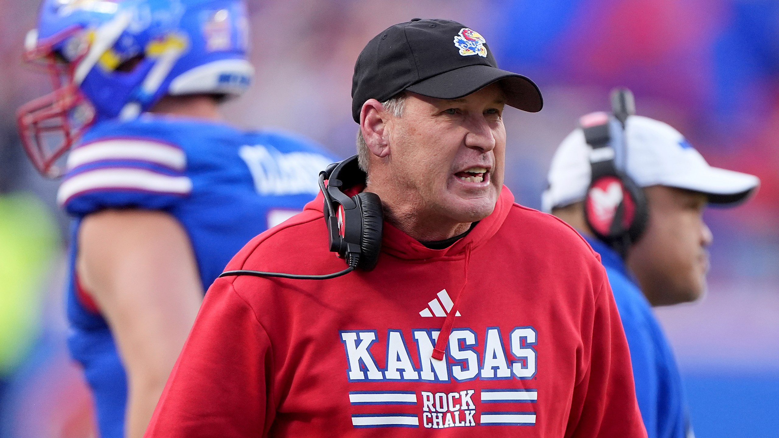 Kansas head coach Lance Leipold talks to his players during the first half of an NCAA college football game against Colorado, Saturday, Nov. 23, 2024, in Kansas City, Mo. (AP Photo/Charlie Riedel)