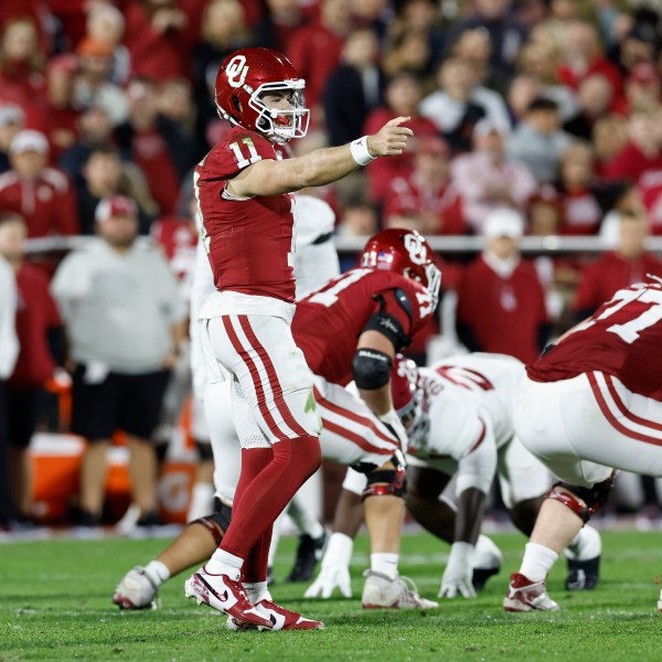 Oklahoma quarterback Jackson Arnold (11) gestures to his team before a play against Alabama during the second quarter of a NCAA college football game Saturday, Nov. 23, 2024, in Norman, Okla. (AP Photo/Alonzo Adams)