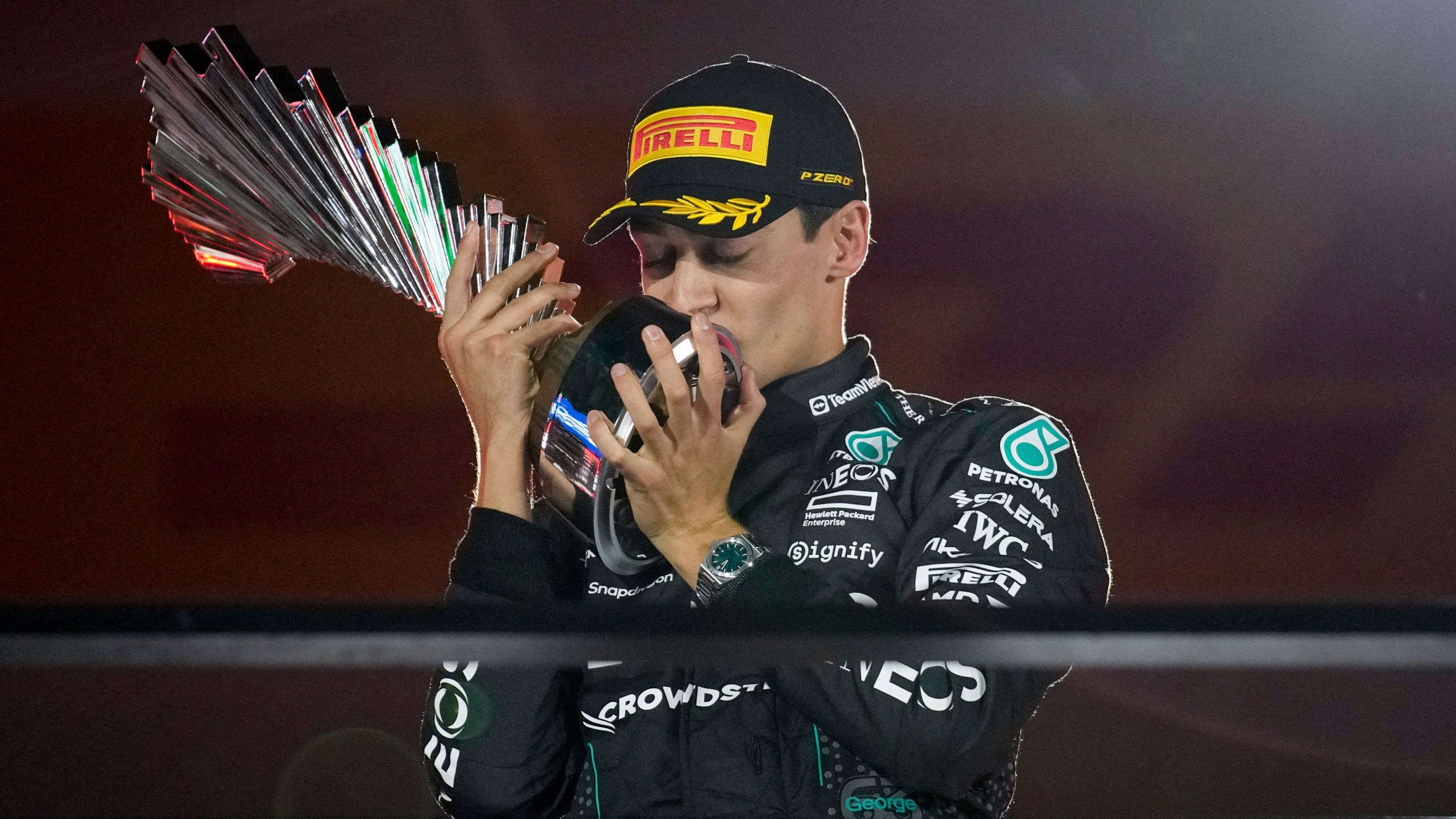 Mercedes driver George Russell, of Britain, celebrates on the podium after winning during the F1 Las Vegas Grand Prix auto race, Saturday, Nov. 23, 2024, in Las Vegas. (AP Photo/John Locher)