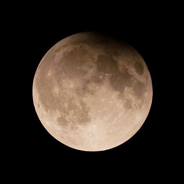 FILE - A supermoon with a partial lunar eclipse rises over Lake Michigan in Chicago, Sept. 17, 2024. (AP Photo/Kiichiro Sato, File)