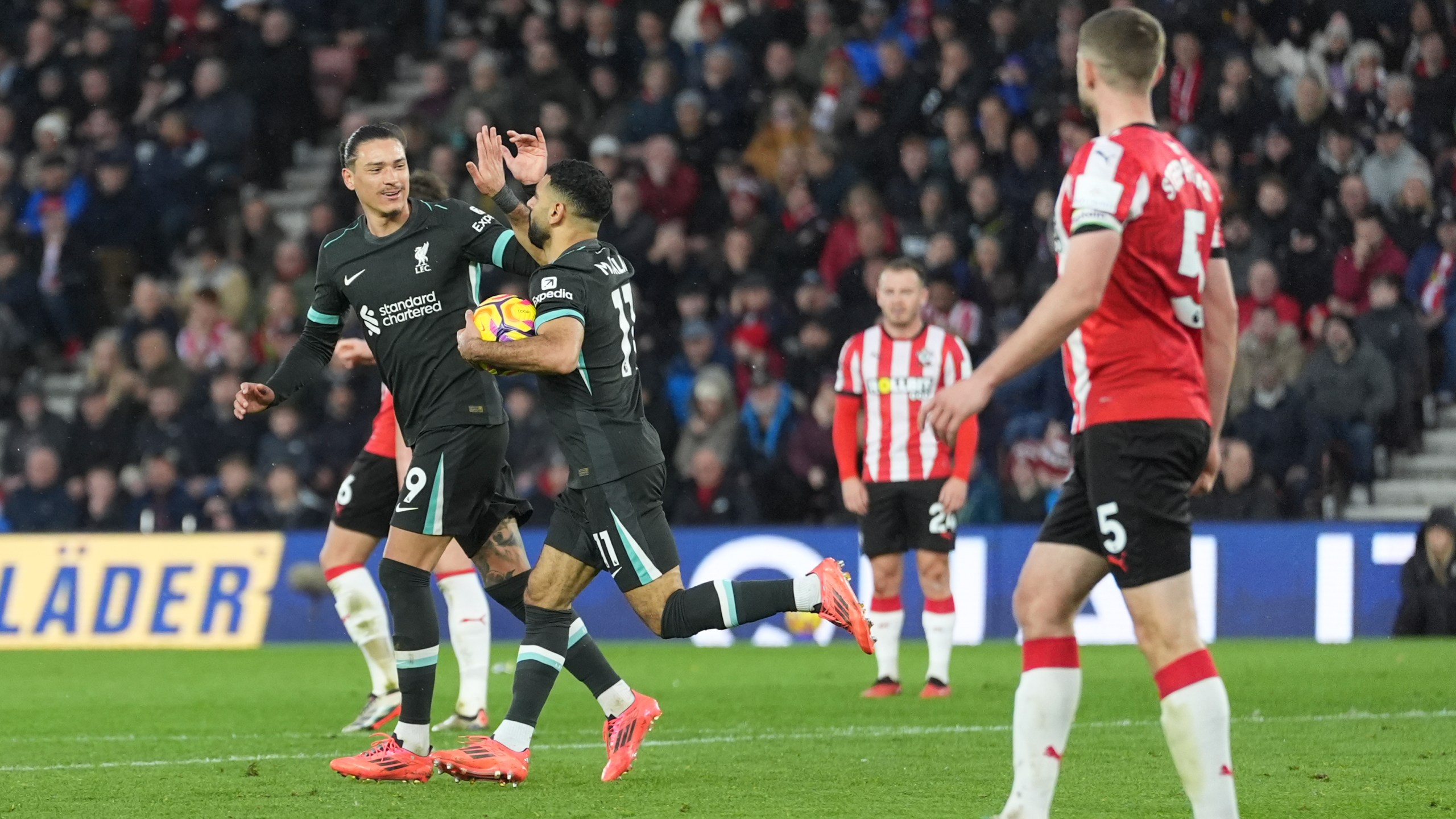 Liverpool's Mohamed Salah, right, celebrates with Darwin Nunez after scoring during the English Premier League soccer match between Southampton and Liverpool in Southampton, England, Sunday, Nov. 24, 2024. (AP Photo/Sean Ryan)