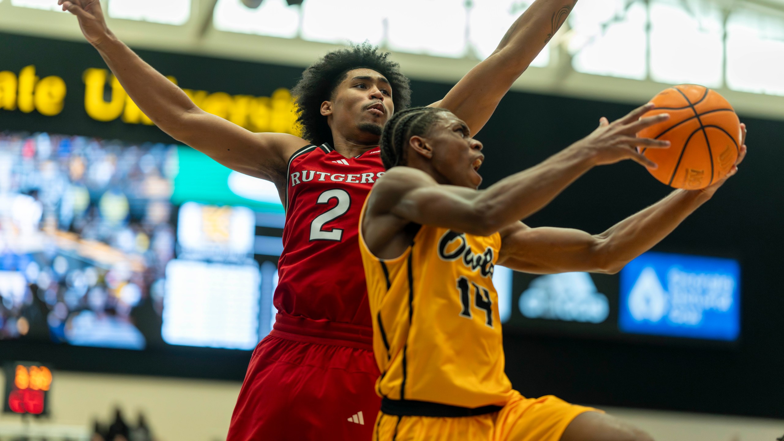 Rutgers guard Dylan Harper (2) defends against Kennesaw State guard Adrian Wooley (14) during the first half of an NCAA college basketball game, Sunday, Nov. 24, 2024, in Kennesaw, Ga. (AP Photo/Erik Rank)