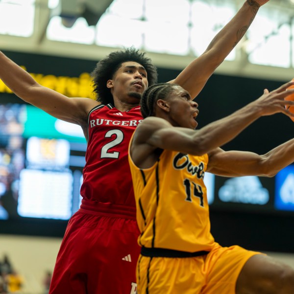 Rutgers guard Dylan Harper (2) defends against Kennesaw State guard Adrian Wooley (14) during the first half of an NCAA college basketball game, Sunday, Nov. 24, 2024, in Kennesaw, Ga. (AP Photo/Erik Rank)