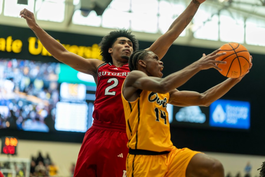 Rutgers guard Dylan Harper (2) defends against Kennesaw State guard Adrian Wooley (14) during the first half of an NCAA college basketball game, Sunday, Nov. 24, 2024, in Kennesaw, Ga. (AP Photo/Erik Rank)