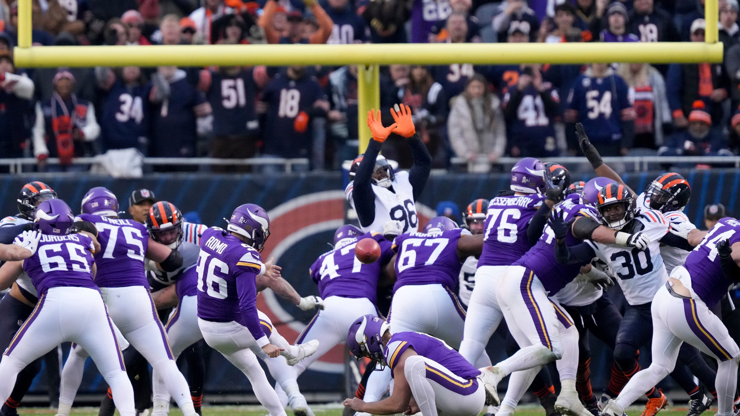 Minnesota Vikings place kicker Parker Romo (96) makes the game-wining field goal in overtime of an NFL football game against the Chicago Bears, Sunday, Nov. 24, 2024, in Chicago. (AP Photo/Charles Rex Arbogast)