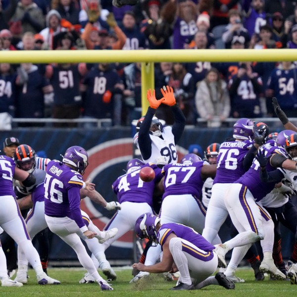 Minnesota Vikings place kicker Parker Romo (96) makes the game-wining field goal in overtime of an NFL football game against the Chicago Bears, Sunday, Nov. 24, 2024, in Chicago. (AP Photo/Charles Rex Arbogast)