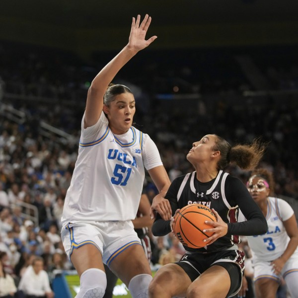 South Carolina guard Tessa Johnson drives against UCLA center Lauren Betts (51) during the first half of an NCAA college basketball game, Sunday, Nov. 24, 2024, in Los Angeles. (AP Photo/Eric Thayer)