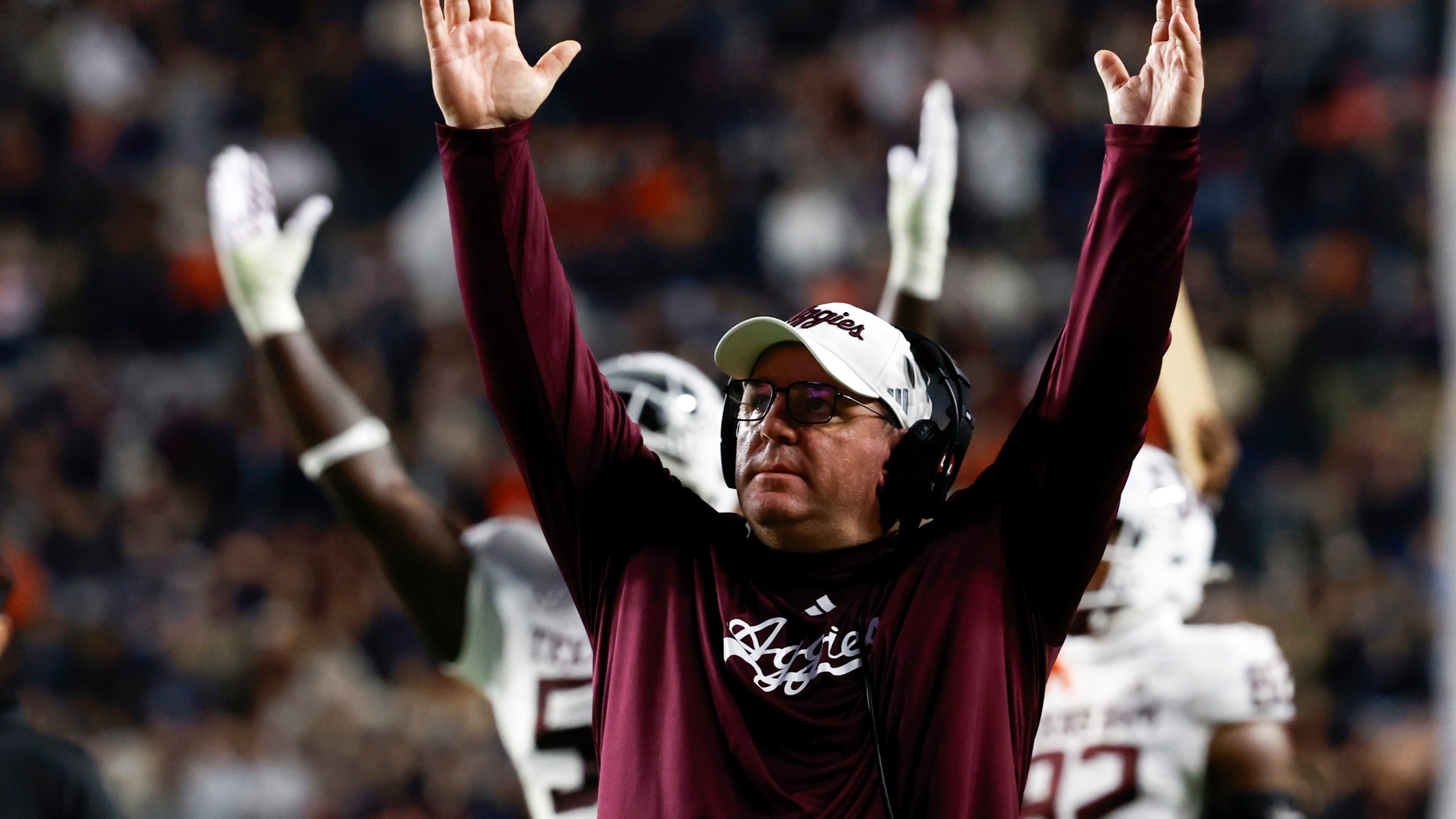 Texas A&M head coach Mike Elko reacts after a touchdown against Auburn during the first half of an NCAA college football game, Saturday, Nov. 23, 2024, in Auburn, Ala. (AP Photo/Butch Dill)