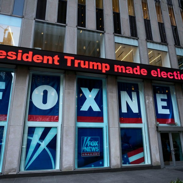 FILE - A headline about President Donald Trump is shown outside Fox News studios, Nov. 28, 2018, in New York. (AP Photo/Mark Lennihan, File)