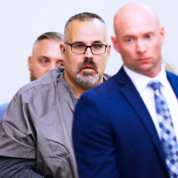 Ex-Letcher County Sheriff Shawn "Mickey" Stines in tears seeing his family as he enters a Letcher County Circuit Court courtroom on November 25, 2024, during his arraignment for the September fatal shooting of district judge Kevin Mullins in Whitesburg, Ky. (Tasha Poullard/Lexington Herald-Leader via AP)