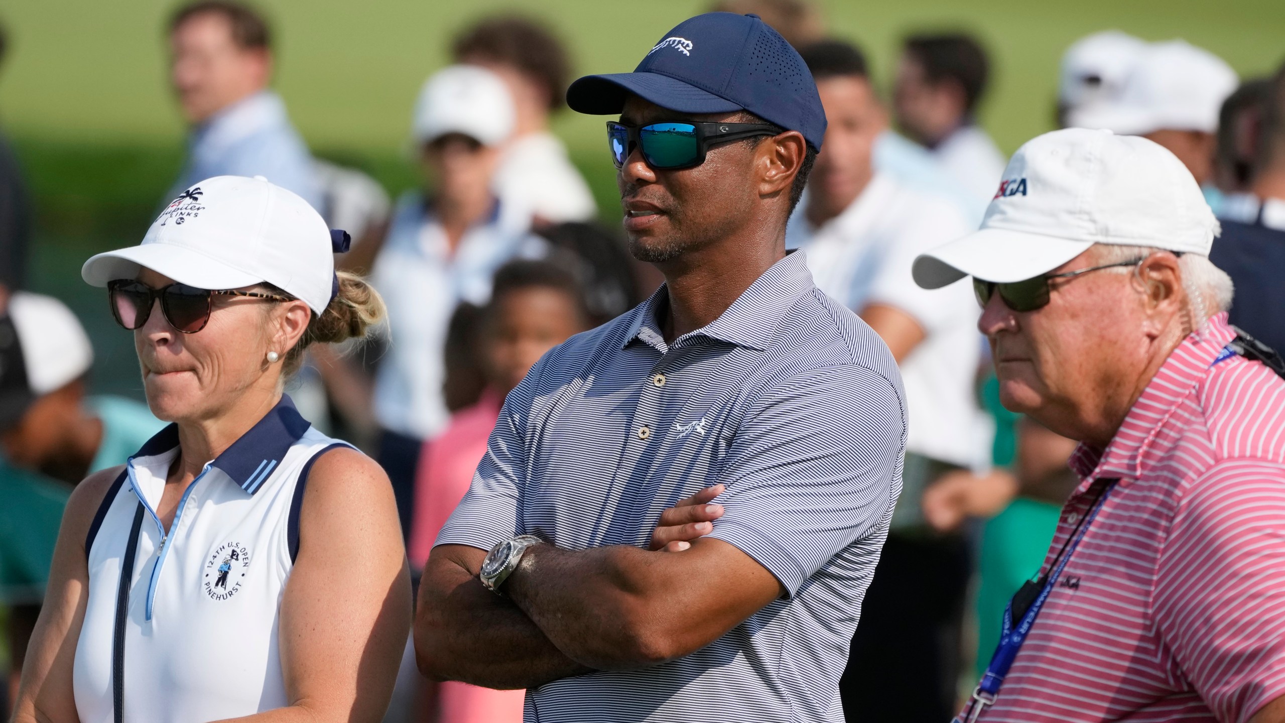 FILE - Tiger Woods watches his son Charlie Woods during the second round of stroke play at the U.S. Junior Amateur Golf Championship on July 23, 2024, in Bloomfield Township, Mich. (AP Photo/Carlos Osorio, File)