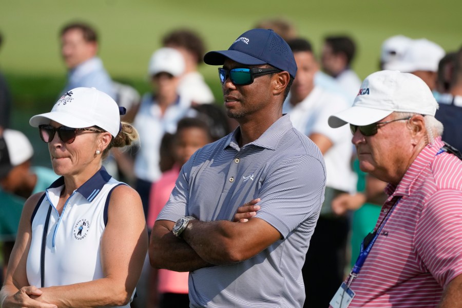 FILE - Tiger Woods watches his son Charlie Woods during the second round of stroke play at the U.S. Junior Amateur Golf Championship on July 23, 2024, in Bloomfield Township, Mich. (AP Photo/Carlos Osorio, File)