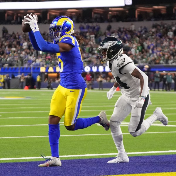 Los Angeles Rams wide receiver Demarcus Robinson, left, catches a touchdown in front of Philadelphia Eagles cornerback Isaiah Rodgers during the second half of an NFL football game in Inglewood, Calif., Sunday, Nov. 24, 2024. (AP Photo/Mark J. Terrill)