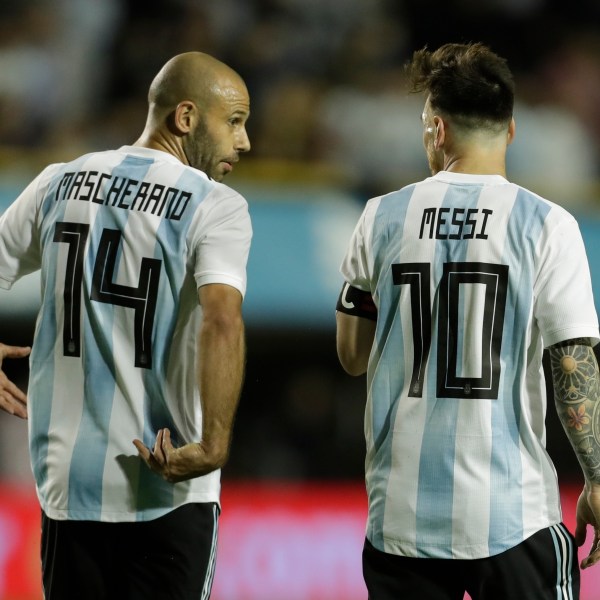 FILE - Argentina's Javier Mascherano, left, and Lionel Messi talk after Messi scored during a friendly soccer match between Argentina and Haiti in Buenos Aires, Argentina, on May 29, 2018. (AP Photo/Victor R. Caivano, File)