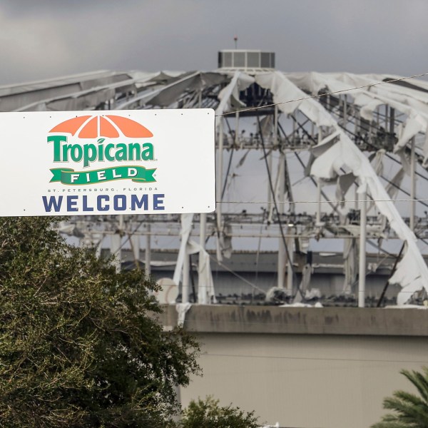 FILE - Signage at the entrance to the parking lot of Tropicana Field where the roof was torn off during Hurricane Milton on Thursday, Oct. 10, 2024, in St. Petersburg, Fla. (AP Photo/Mike Carlson, File)