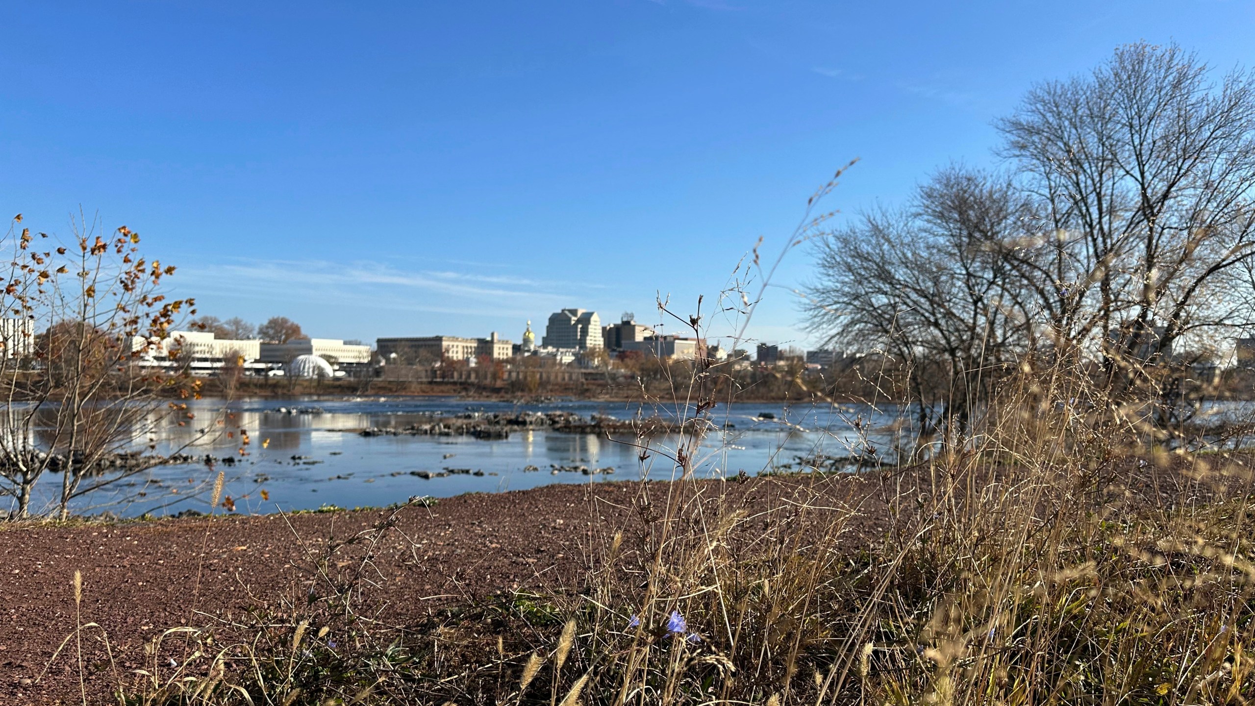 The Delaware River overlooking Trenton, N.J. flows downstream as seen from from Morrisville, Pa., on Monday, Nov. 25, 2024. (AP Photo/Mike Catalini)