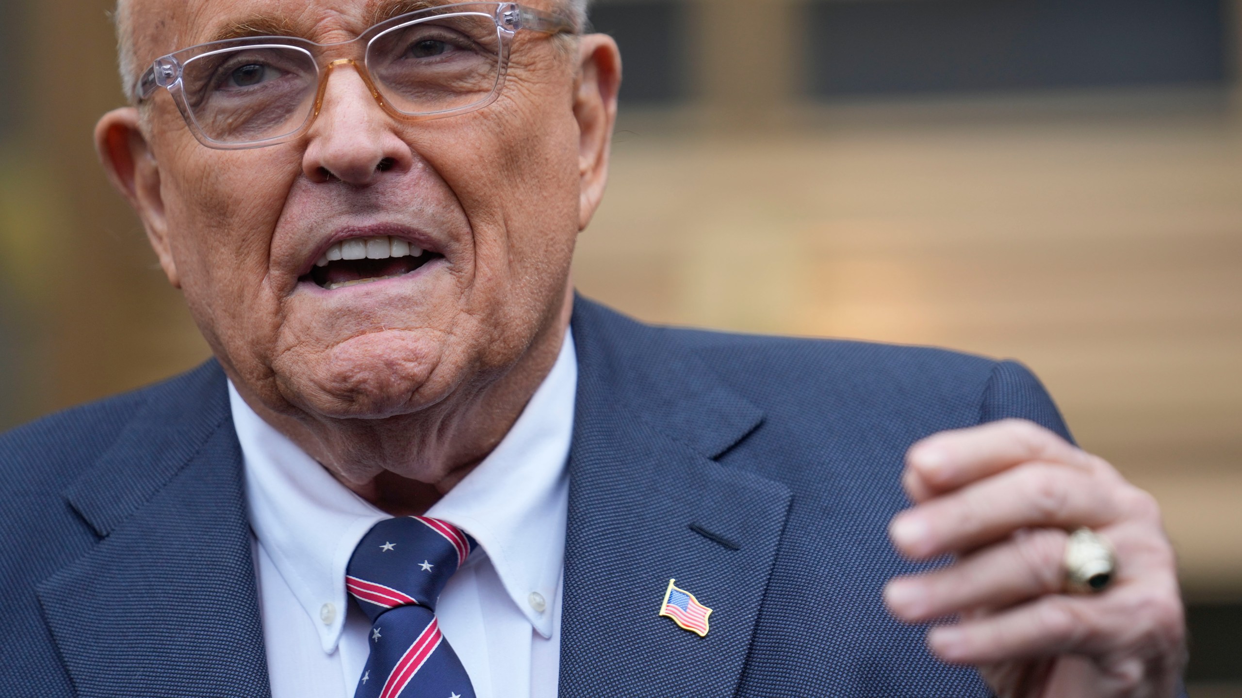 Rudy Giuliani speaks to reporters as he leaves the federal courthouse in New York, Tuesday, Nov. 26, 2024. (AP Photo/Seth Wenig)