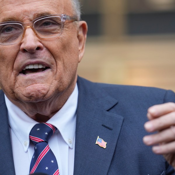 Rudy Giuliani speaks to reporters as he leaves the federal courthouse in New York, Tuesday, Nov. 26, 2024. (AP Photo/Seth Wenig)