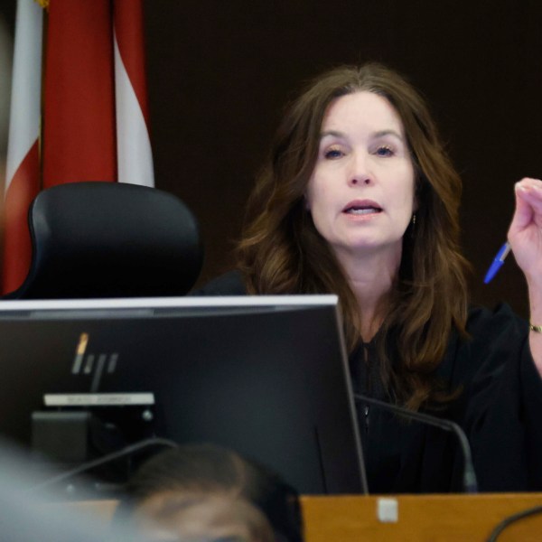 Fulton County Superior Court Judge Paige Reese Whitaker speaks with a prosecutor during the Young Thug trial at Fulton County Courthouse in Atlanta on Tuesday, Nov. 26, 2024. (Miguel Martinez/Atlanta Journal-Constitution via AP)