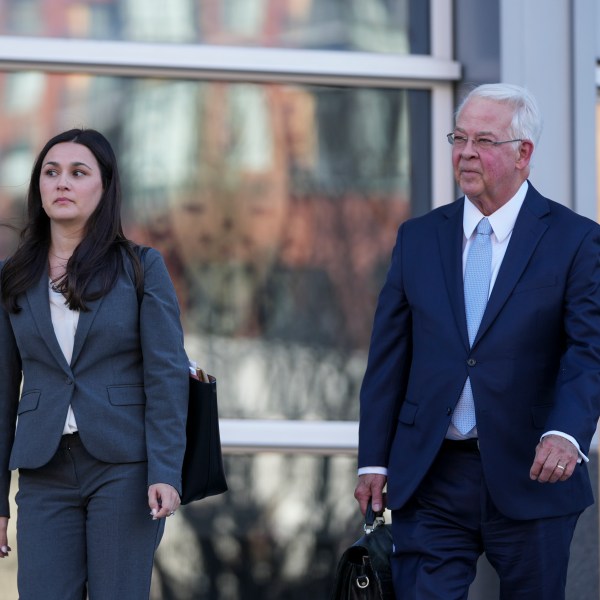 Megan Coleman and Robert Bonsib, attorneys representing Eduardo Valdivia, an FBI agent accused of sexually assaulting two women, leave the Montgomery County District Court in Rockville, Md., following a bond hearing for Valdivia, Tuesday, Nov. 26, 2024. (AP Photo/Stephanie Scarbrough)