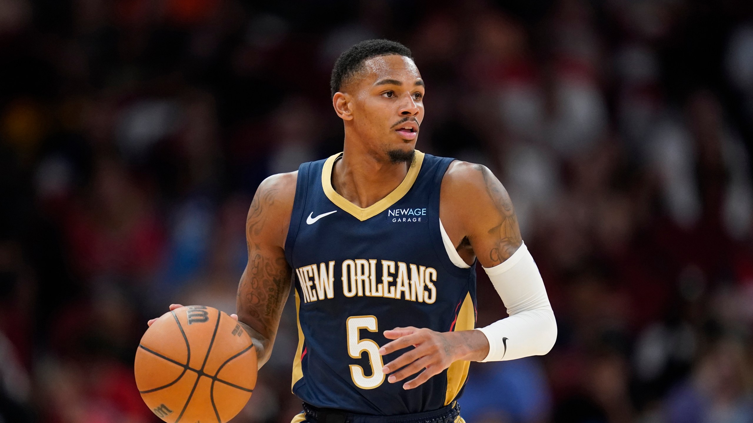 FILE - New Orleans Pelicans guard Dejounte Murray dribbles against the Houston Rockets during the second half of an NBA preseason basketball game, Oct. 15, 2024, in Houston. (AP Photo/Eric Christian Smith, File)