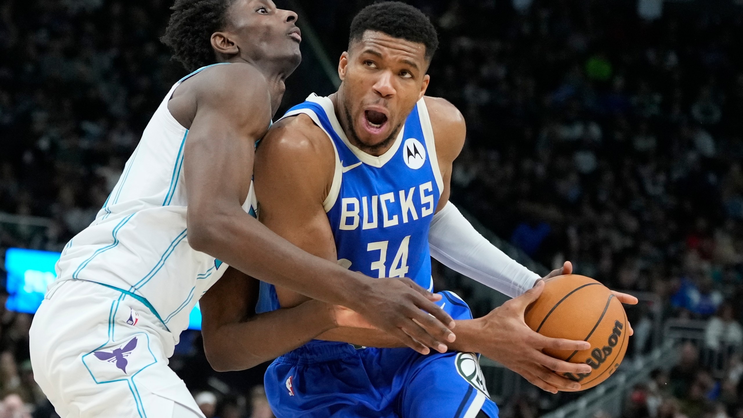 Charlotte Hornets' Moussa Diabate fouls Milwaukee Bucks' Giannis Antetokounmpo during the second half of an NBA basketball game Saturday, Nov. 23, 2024, in Milwaukee. The Bucks won 125-119. (AP Photo/Morry Gash)