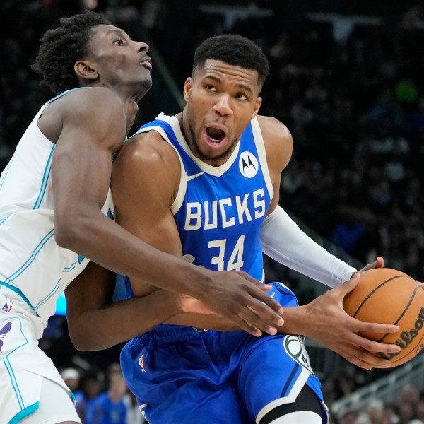 Charlotte Hornets' Moussa Diabate fouls Milwaukee Bucks' Giannis Antetokounmpo during the second half of an NBA basketball game Saturday, Nov. 23, 2024, in Milwaukee. The Bucks won 125-119. (AP Photo/Morry Gash)