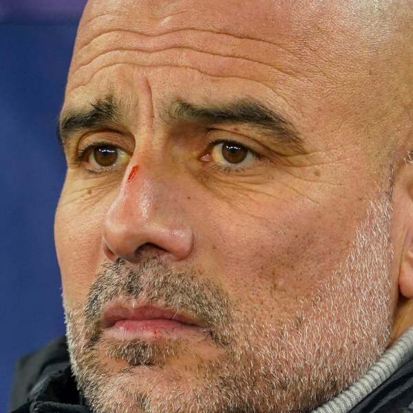 Manchester City's head coach Pep Guardiola takes his seat on the bench before the Champions League opening phase soccer match between Manchester City and Feyenoord at the Etihad Stadium in Manchester, England, Tuesday, Nov. 26, 2024. (AP Photo/Dave Thompson)