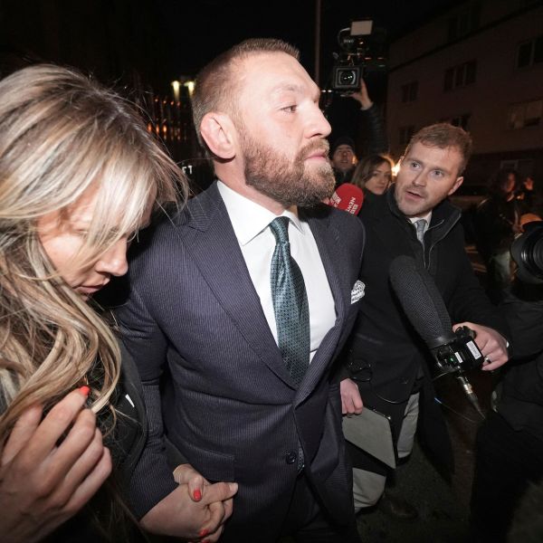 Mixed martial arts fighter Conor McGregor and partner Dee Devlin leave the High Court in Dublin, Ireland, Friday Nov. 22, 2024. (Brian Lawless/PA via AP)