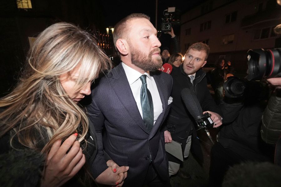 Mixed martial arts fighter Conor McGregor and partner Dee Devlin leave the High Court in Dublin, Ireland, Friday Nov. 22, 2024. (Brian Lawless/PA via AP)