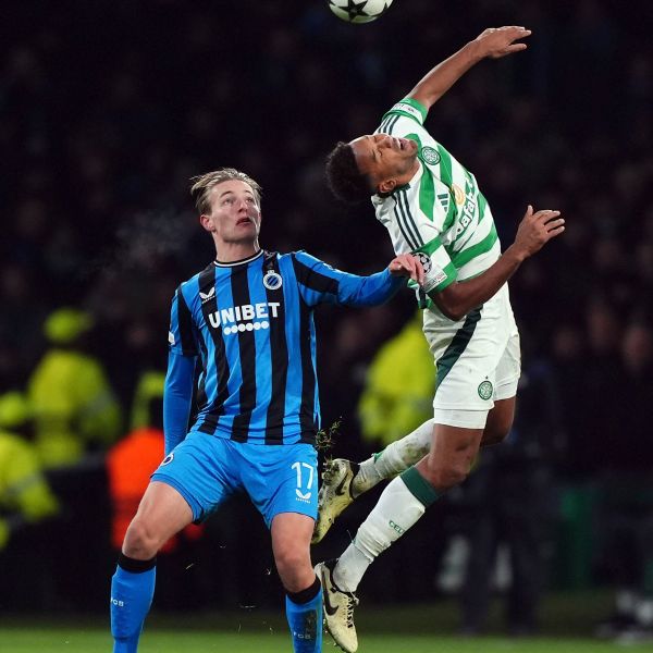 Celtic's Auston Trusty and Club Brugge's Romeo Vermant, left, in action during the UEFA Champions League opening phase soccer stage match at Celtic Park, Glasgow, Scotland, Wednesday Nov. 27, 2024. (Andrew Milligan/PA via AP)