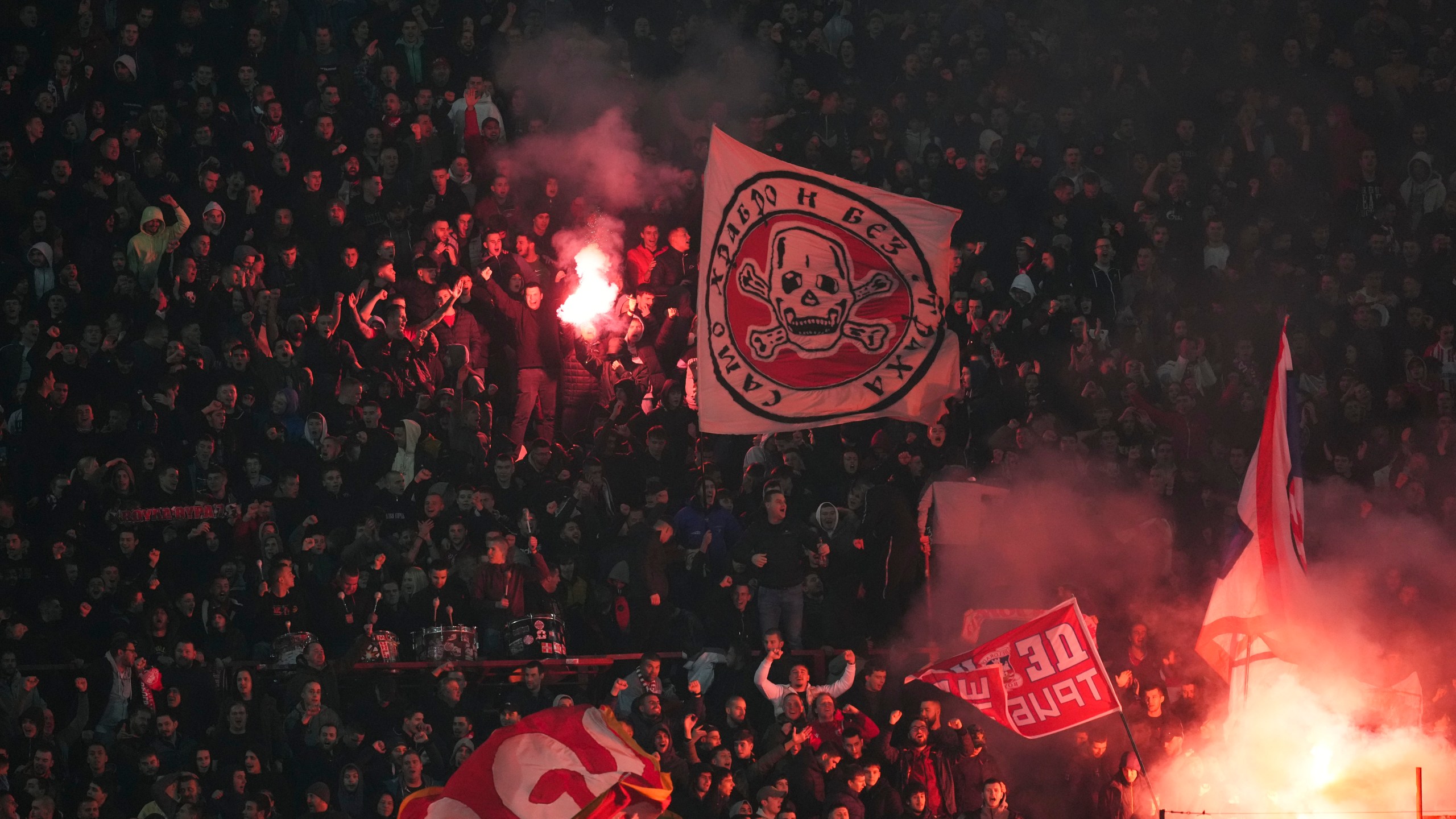 Supporters of Red Star celebrate after Mirko Ivanic scored his side's third goal during the Champions League opening phase soccer match between Red Star and Stuttgart at the Rajko Mitic Stadium in Belgrade, Serbia, Wednesday, Nov. 27, 2024. (AP Photo/Darko Vojinovic)