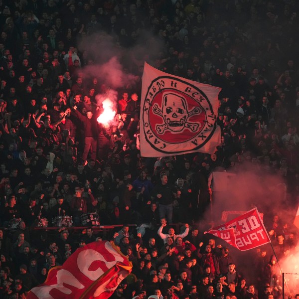 Supporters of Red Star celebrate after Mirko Ivanic scored his side's third goal during the Champions League opening phase soccer match between Red Star and Stuttgart at the Rajko Mitic Stadium in Belgrade, Serbia, Wednesday, Nov. 27, 2024. (AP Photo/Darko Vojinovic)