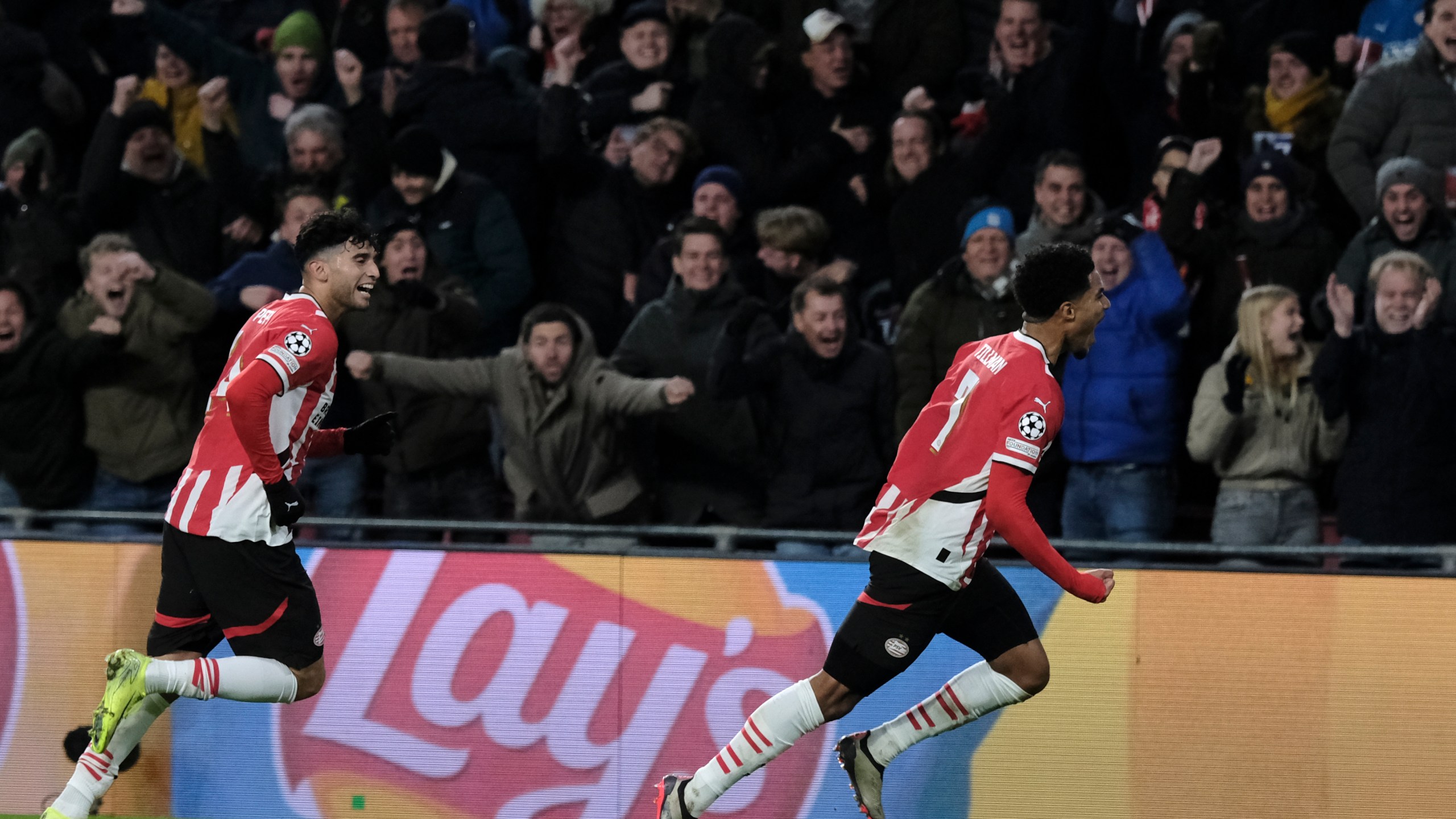 PSV's Malik Tillman, right, celebrates after scoring his sides first goal during the Champions League opening phase soccer match between PSV Eindhoven and Shakhtar Donetsk at the PSV Stadium in Eindhoven, Netherlands, Wednesday, Nov. 27, 2024. (AP Photo/Patrick Post)