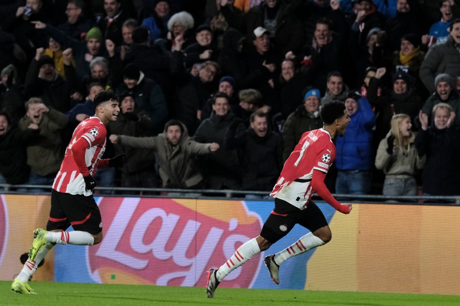 PSV's Malik Tillman, right, celebrates after scoring his sides first goal during the Champions League opening phase soccer match between PSV Eindhoven and Shakhtar Donetsk at the PSV Stadium in Eindhoven, Netherlands, Wednesday, Nov. 27, 2024. (AP Photo/Patrick Post)