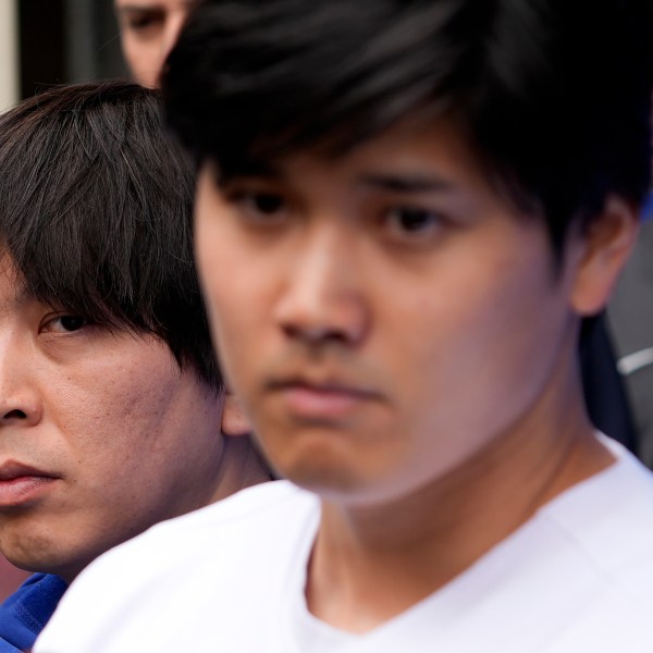 FILE - Ippei Mizuhara, left, stands next to Los Angeles Dodgers baseball player Shohei Ohtani, right, during an interview at Dodger Stadium, Feb. 3, 2024. (AP Photo/Richard Vogel, File)