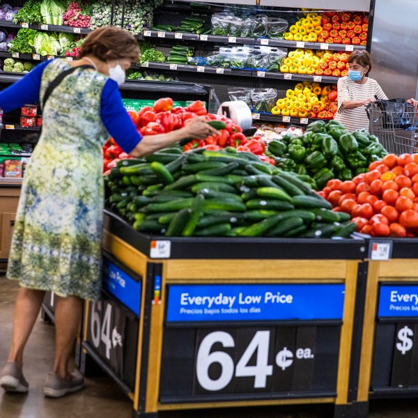 FILE - People buy groceries at a Walmart Superstore in Secaucus, New Jersey, July 11, 2024. (AP Photo/Eduardo Munoz Alvarez, File)