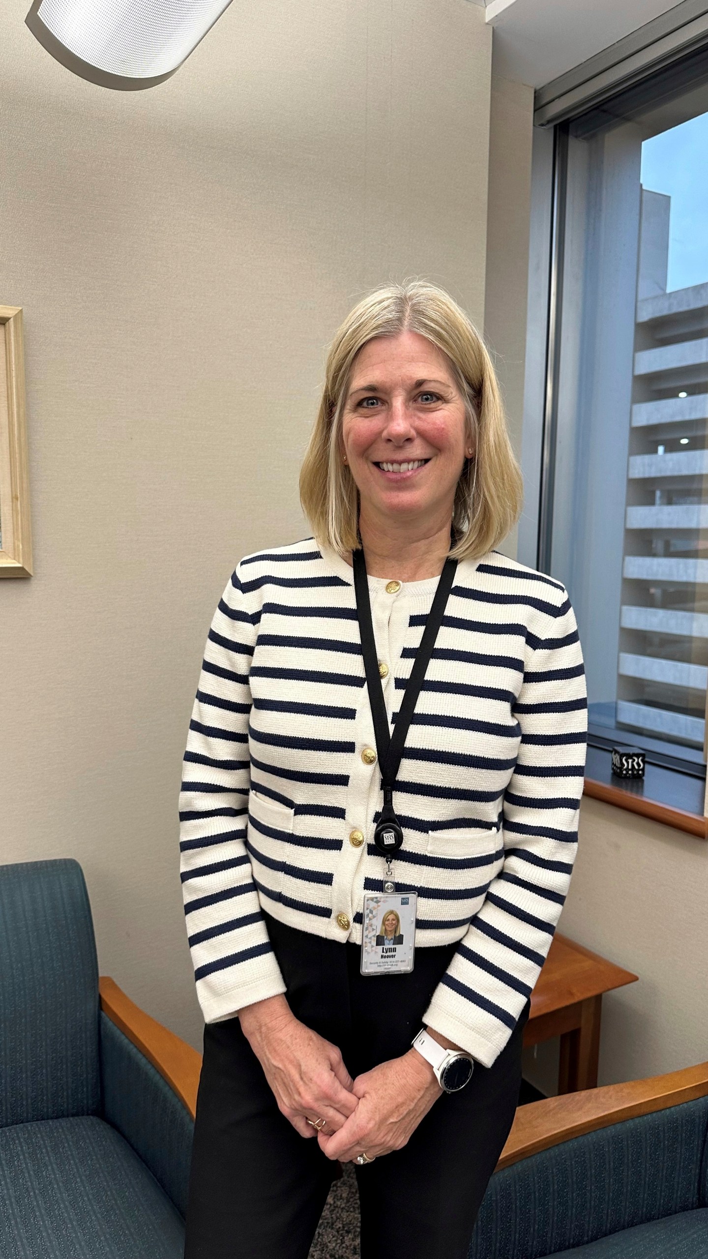 Acting Executive Director and Chief Financial Officer Lynn Hoover poses in her office at the headquarters of the State Teachers Retirement System in Columbus, Ohio, on Friday, Nov. 22, 2024. (AP Photo/Julie Carr Smyth)