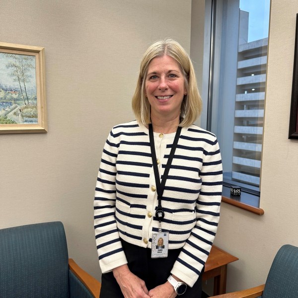 Acting Executive Director and Chief Financial Officer Lynn Hoover poses in her office at the headquarters of the State Teachers Retirement System in Columbus, Ohio, on Friday, Nov. 22, 2024. (AP Photo/Julie Carr Smyth)